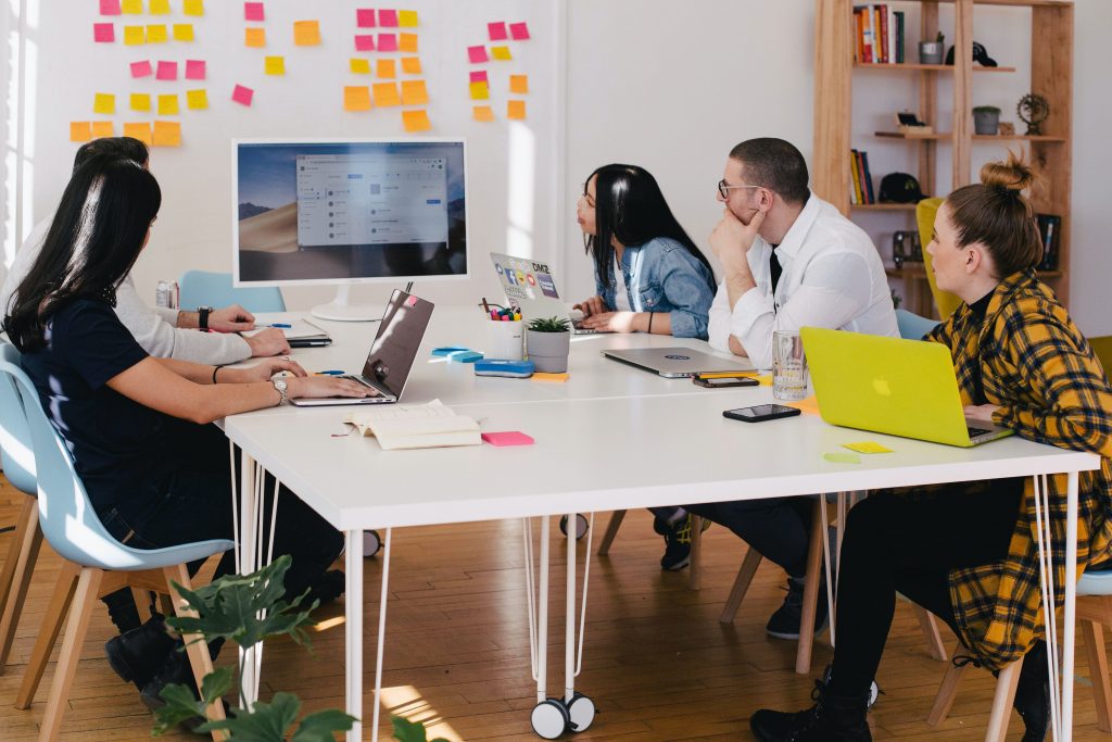 A group of people shortlisting a design company